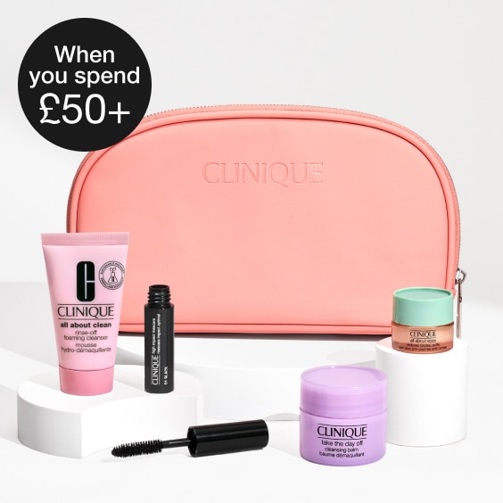 Spin for Clinique Treats randomizer in front of a bright orange background, with spider webs in the corners