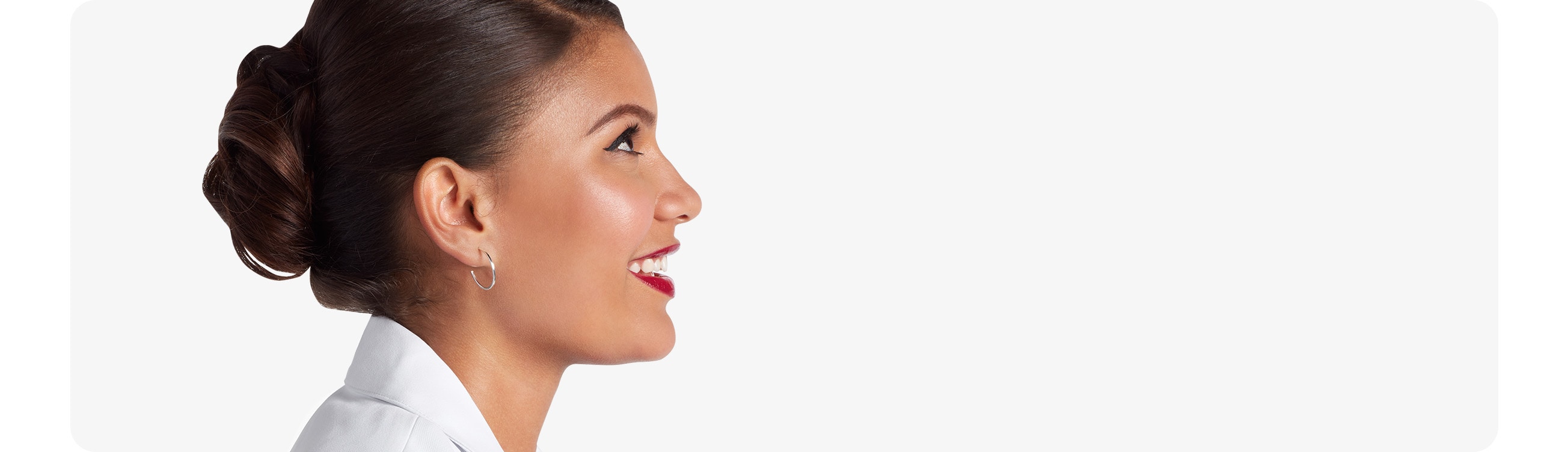 Clinique Consultant smiling wearing a white lab coat