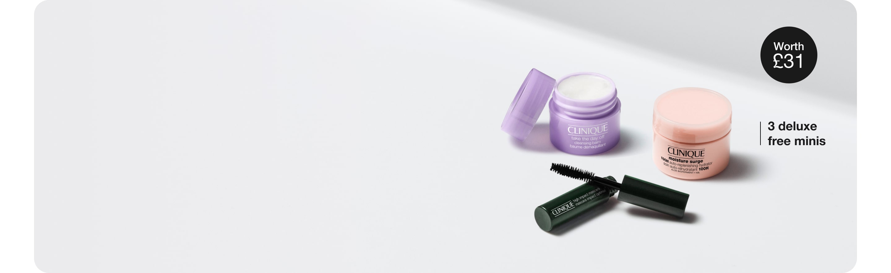 3 deluxe Clinique samples in a brightly lit setting