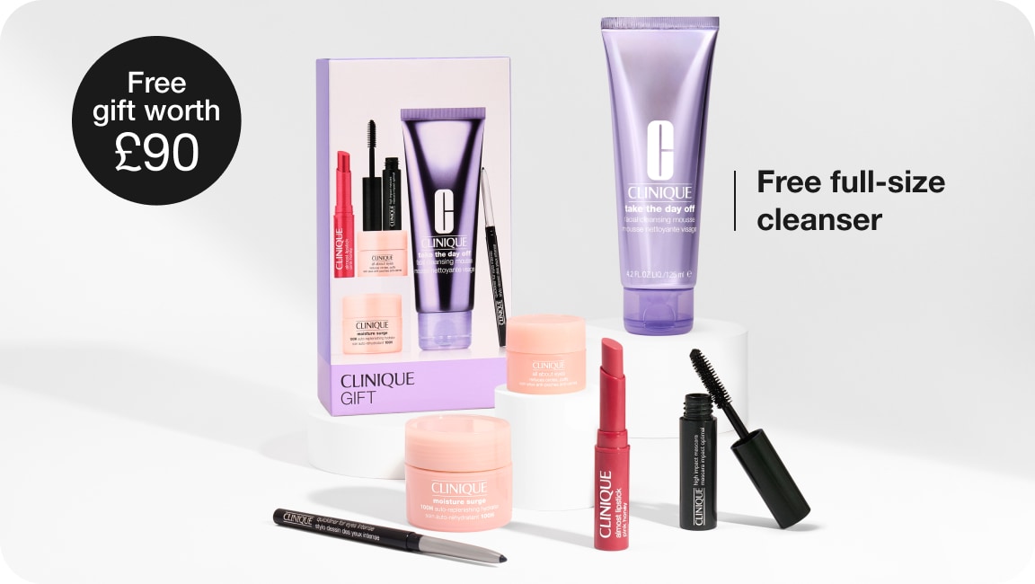 Selection of full-size Clinique products in front of a grey background, with black illustrated sparkles dotted around