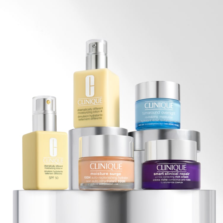 Selection of new brow and eye products dynamically placed on a glass shelf, in a brightly lit studio setting