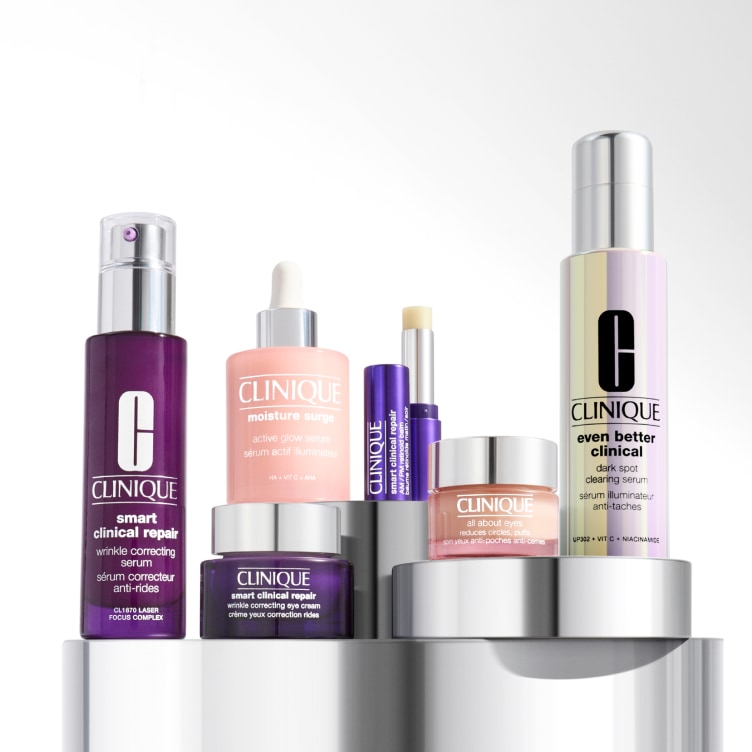 Selection of new brow and eye products dynamically placed on a glass shelf, in a brightly lit studio setting