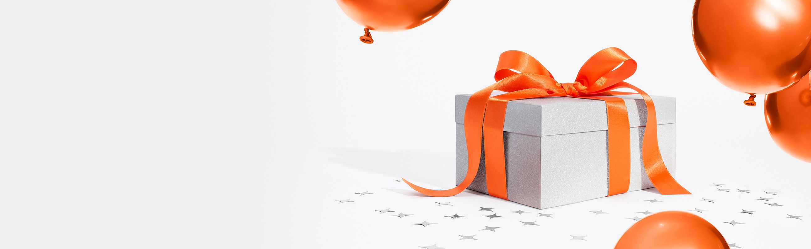 Video animation showing a glittery mystery present slowly opening with silver confetti bursting out