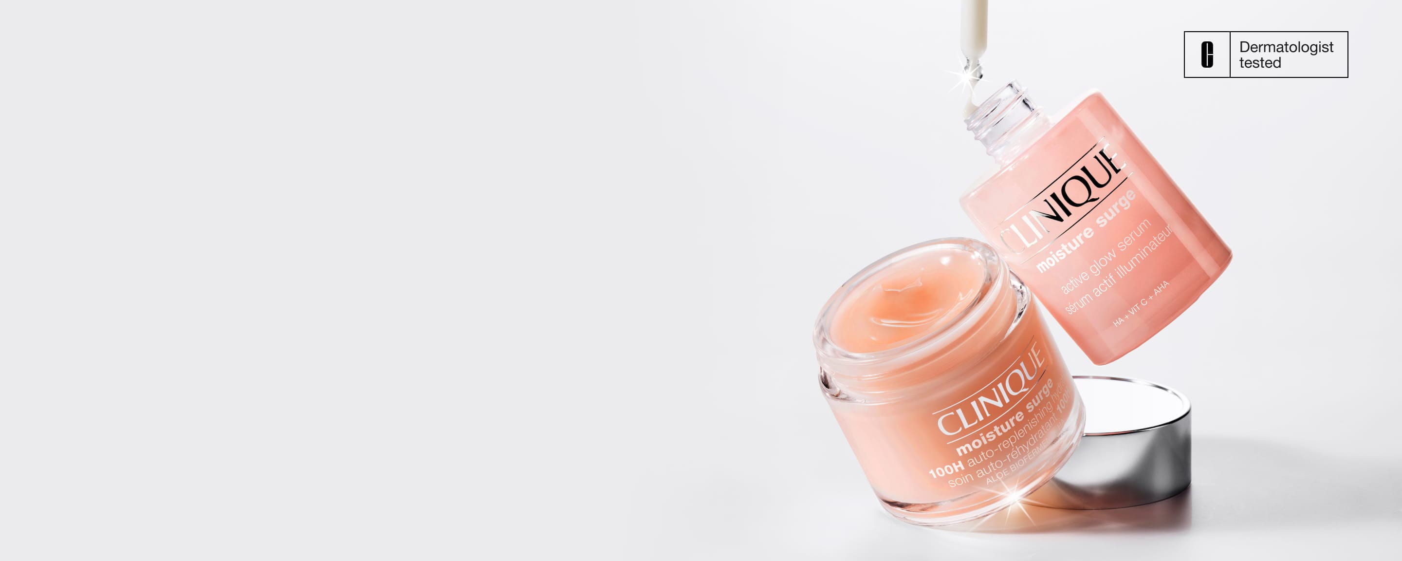 Moisture Surge Active Glow Serum and Moisture Surge Auto-Replenishing Hydrator in a pool of water in a bright setting