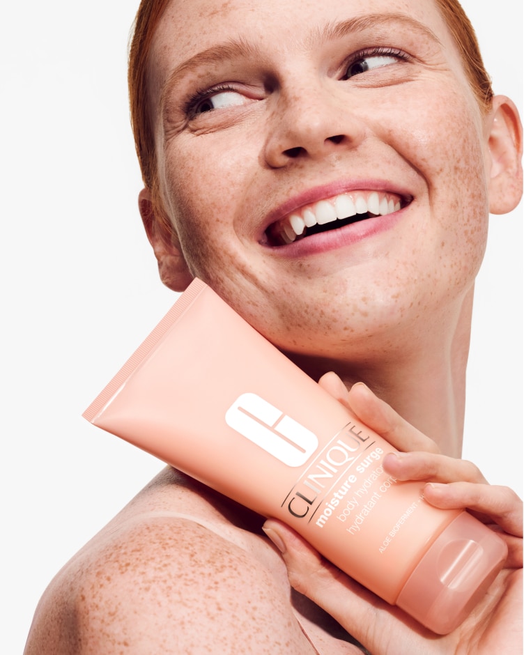 Close up macro shot of Clinique Moisture Surge Serum and Hydrator swatches, on a soft grey background