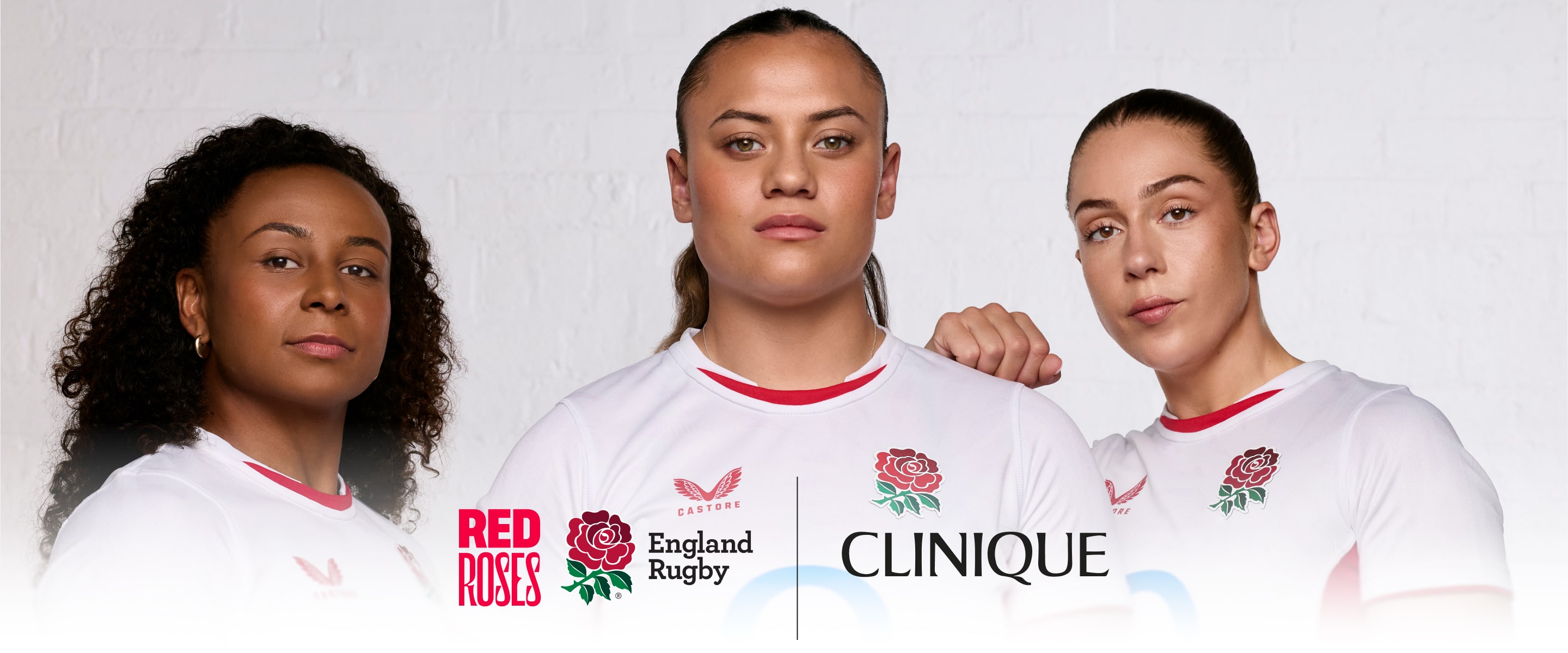 Close up of Holly Aitchison, Jade Shekells and Maddie Feaunati, stood closely together for a team photo
