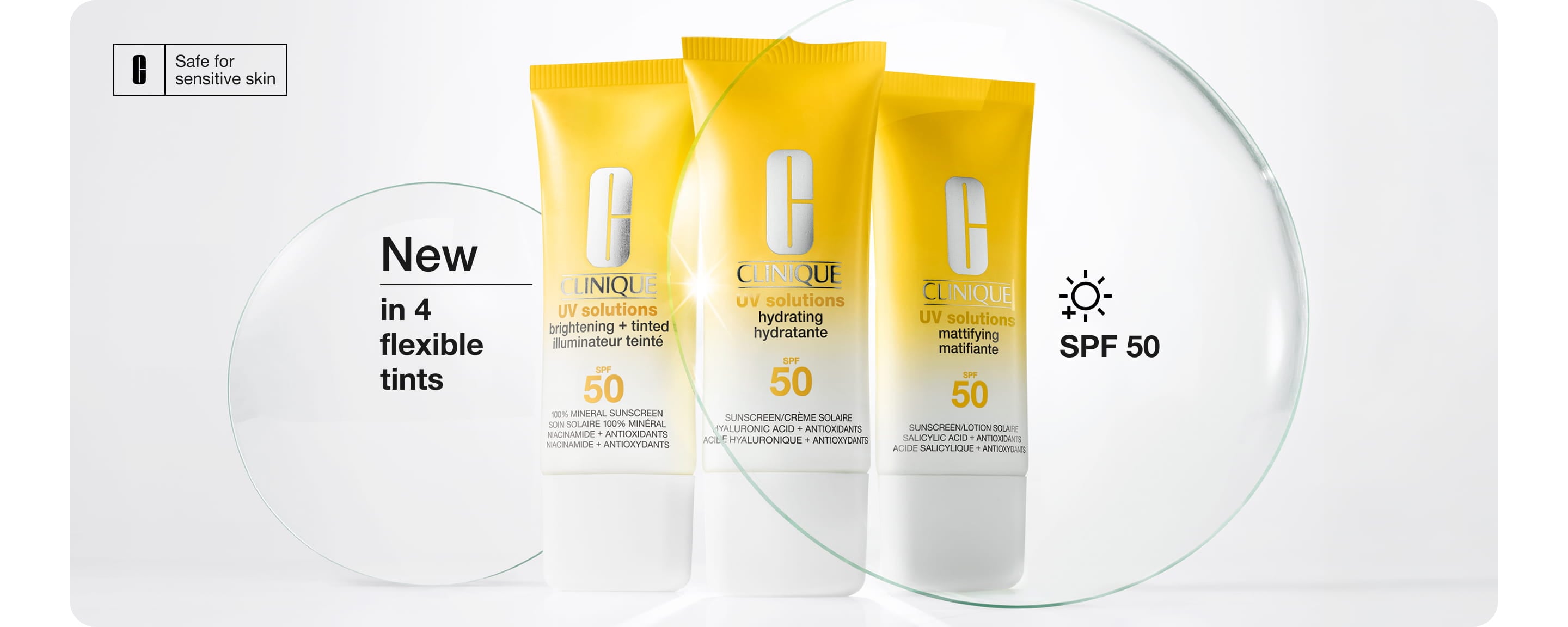 New Clinique UV Solutions Sunscreen SPF 50 in a brightly lit setting, next to glass discs in a brightly lit setting