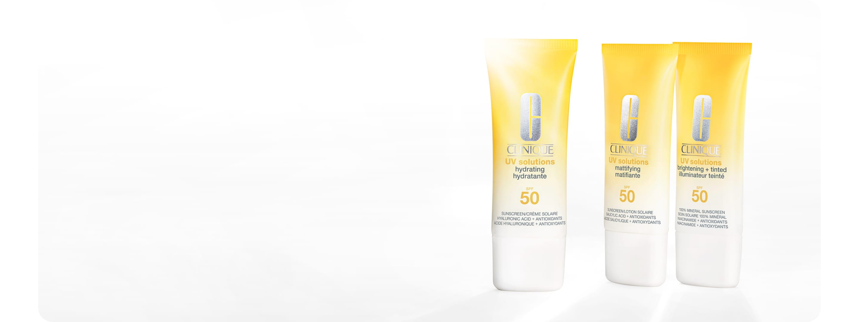 New Clinique UV Solutions Sunscreen SPF 50 in a brightly lit setting, next to glass discs in a brightly lit setting