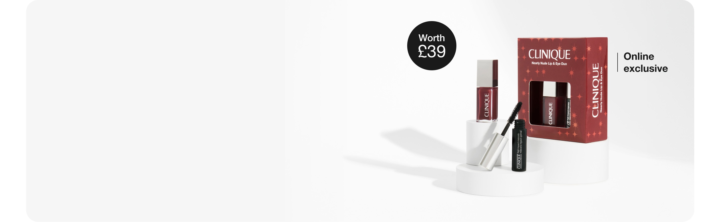 Full-size Moisture Surge Lip Treatment, shot from above, on a grey plinth in a brightly lit, clean setting