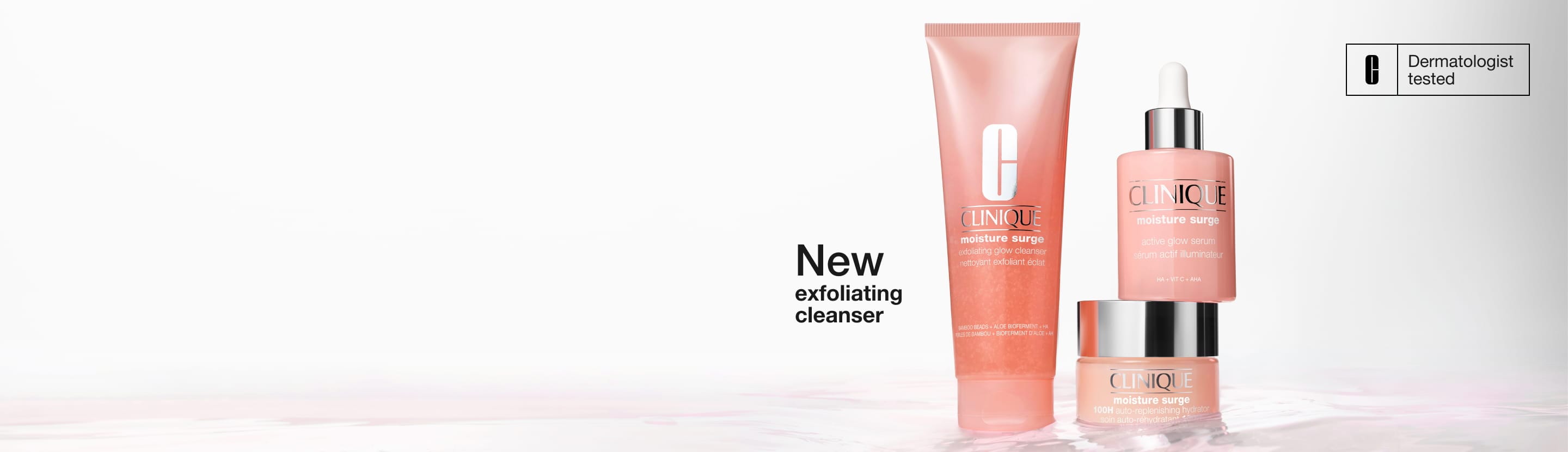 Moisture Surge Serum and 100H Moisturiser stood in a pool of brightly lit, clear water, with hydrating droplets splashing up