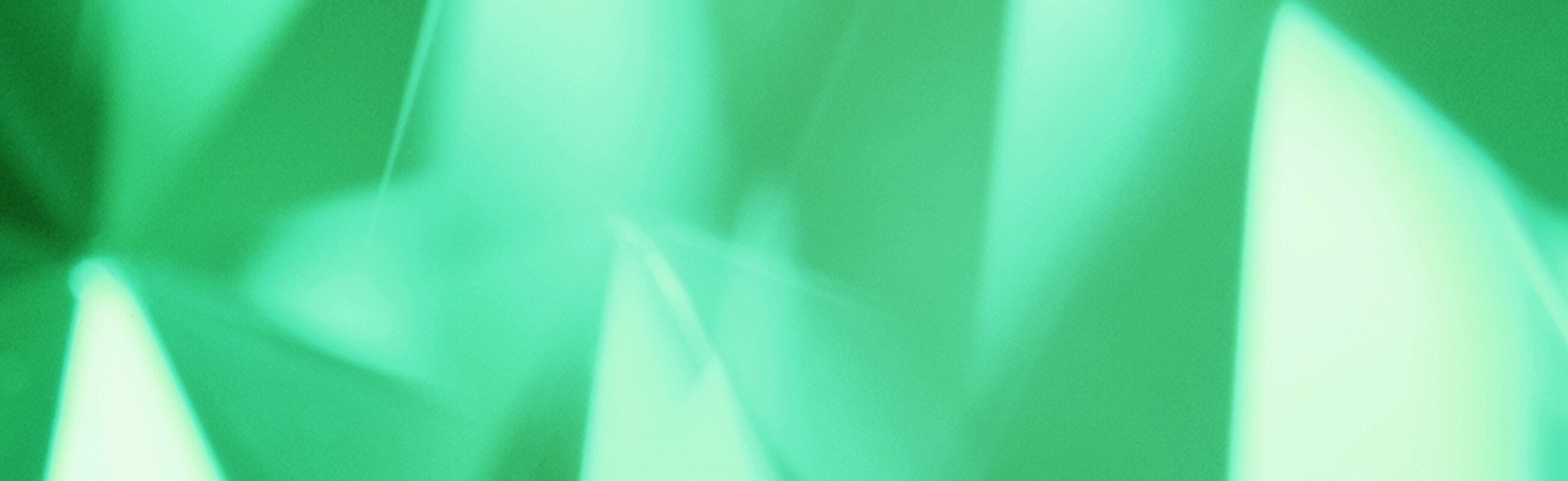 Green gemstone background slowly spinning
